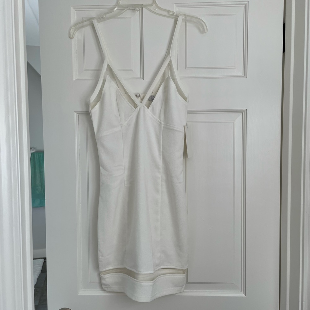 White mini dress with mesh accents